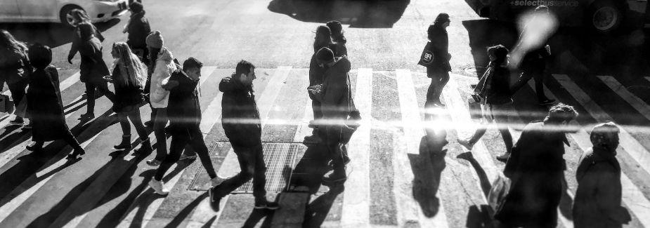 People walking on street crosswalk