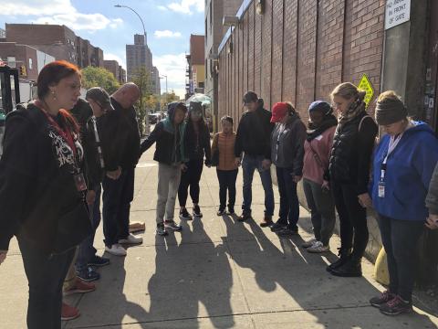 NYC Relief HFNY volunteers praying